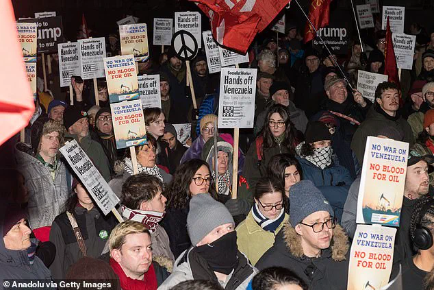 Protesters in London Set U.S. Flag Alight Outside Downing Street in Protest Against Trump's Policy on Maduro