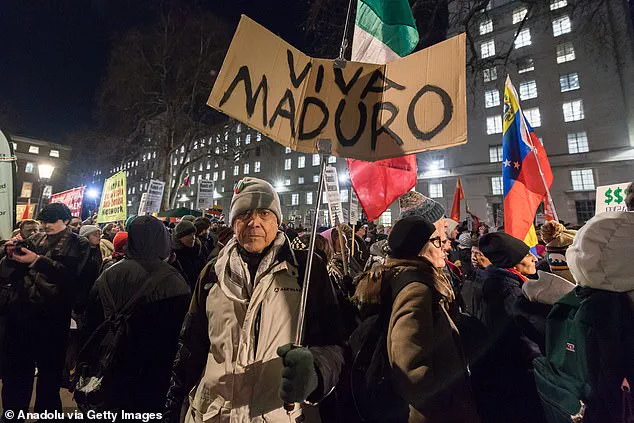 Protesters in London Set U.S. Flag Alight Outside Downing Street in Protest Against Trump's Policy on Maduro