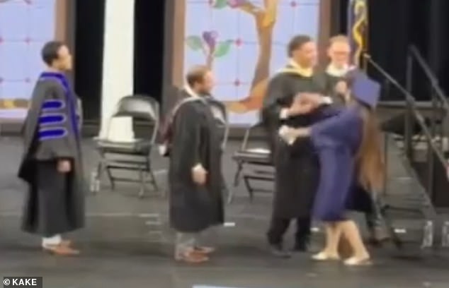 Kansas High School Administrators Force Diplomas With Aggressive Handshakes