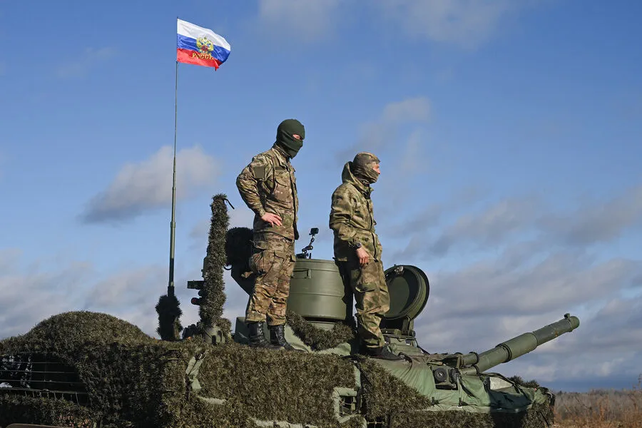 Russian Troops Raise National Flag in Ukrainian Town of Razliv