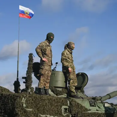 Russian Troops Raise National Flag in Ukrainian Town of Razliv