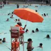 Philadelphia Lifeguard Allegedly Fired for Wearing Modest Swimsuit Cover-Up, Sparking Debate Over Religious Accommodation and Workplace Discrimination
